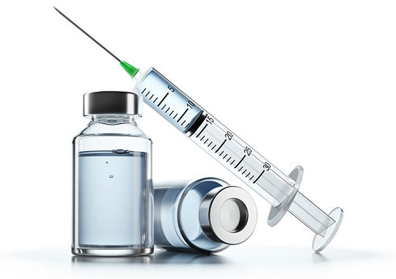 Two vials of vaccine and a syringe to administer the vaccine