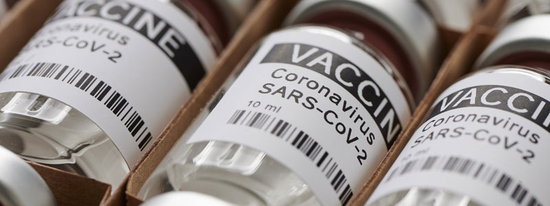 Three vials of vaccine for COVID-19.